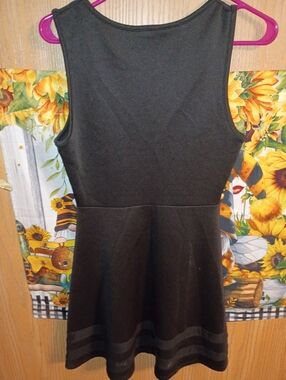A Black Sleeveless Fitted Dress